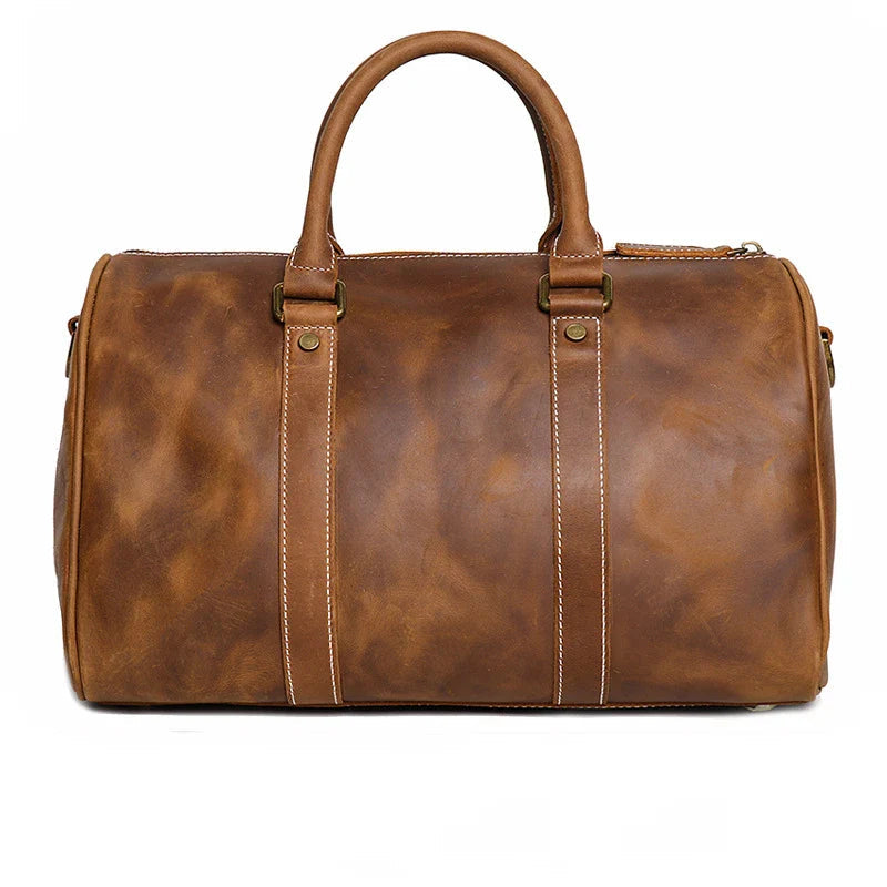 Brown leather duffel bag on a white background