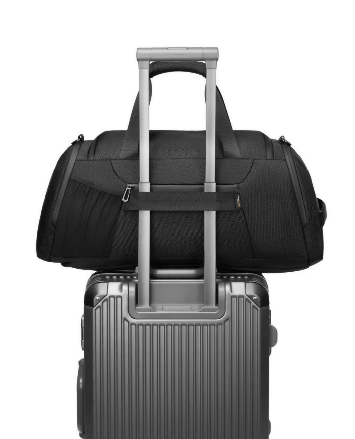 Black duffel bag and silver suitcase on a white background